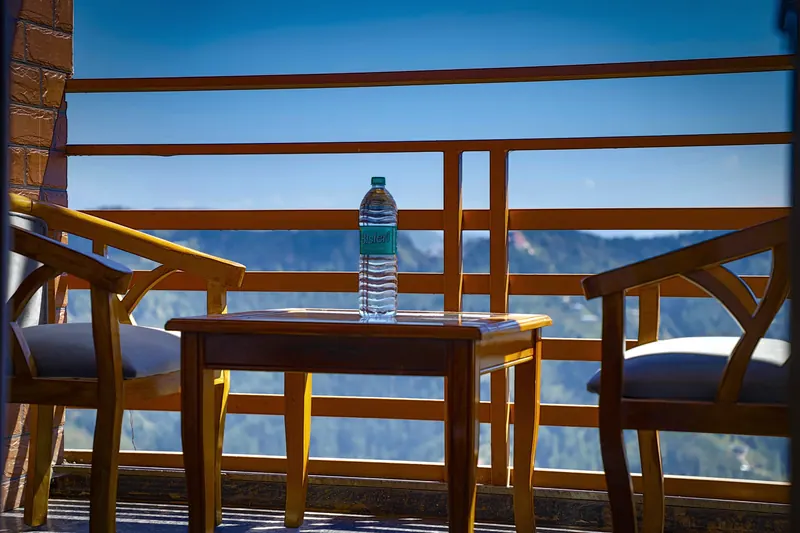 Balcony table and chairs in morning light