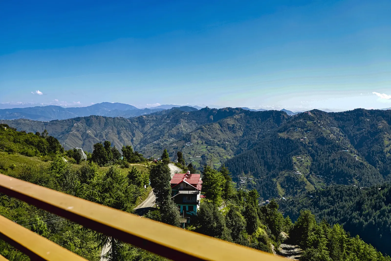 Forested ridgelines seen from a Wood Crista balcony